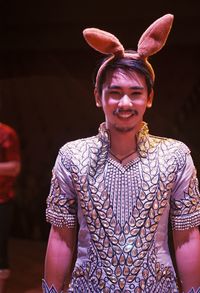 Portrait of smiling young man wearing costume