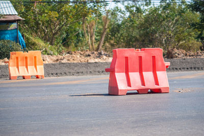 Red flag on road by trees in city