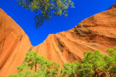 Scenic view of mountains against clear blue sky