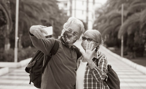 Portrait of man with woman