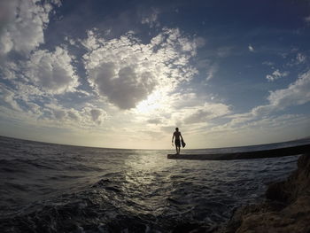 Scenic view of sea against cloudy sky