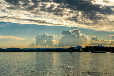 Thunderstorm clouds on lake constance at sunset