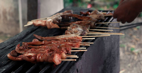 Close-up of meat on barbecue grill