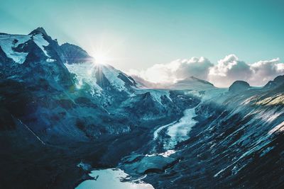 Scenic view of snowcapped mountains against sky