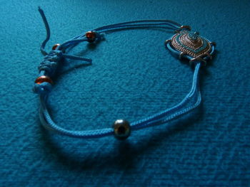 High angle view of ring on blue table