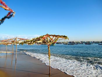 Scenic view of beach against clear sky