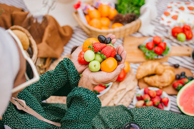 High angle view of man holding fruits