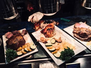 High angle view of meat on barbecue grill