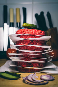 Close-up of burger patties on table