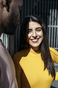 Portrait of smiling young woman