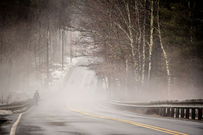 View of fog covered road in city