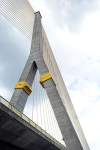 Big suspension bridge in the overcast sky.