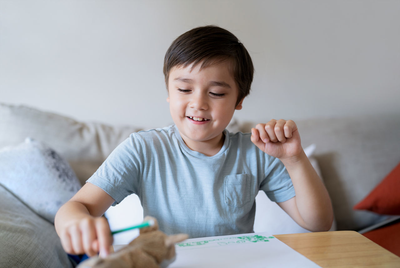 BOY SITTING AT HOME