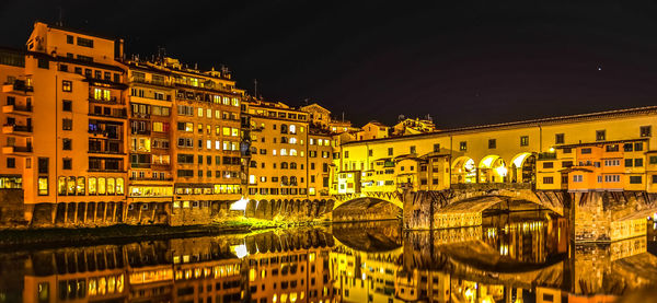 View of buildings in city at night