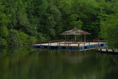 Ruin old houseboat raft floating on the pond is make me reminiscing about when i was a child.