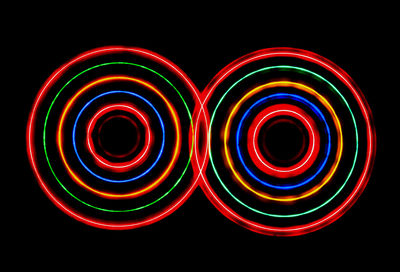 Multi colored light painting against black background