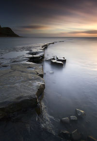 Scenic view of sea against sky during sunset