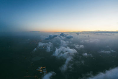 Aerial view of cityscape against sky during sunset