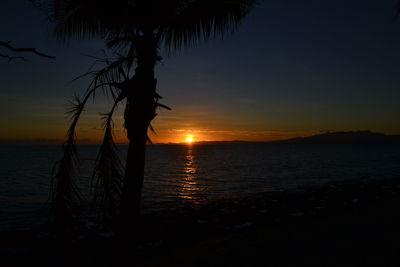 Scenic view of sea against romantic sky at sunset