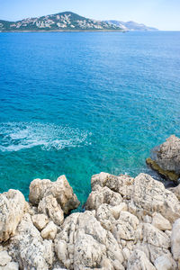 Scenic view of sea against blue sky