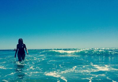 Scenic view of sea against blue sky