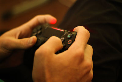 Midsection of man using mobile phone