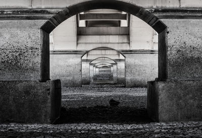 Empty subway along arched walls