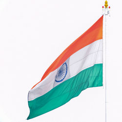 India flag flying high at connaught place with pride in blue sky, india flag fluttering, indian flag