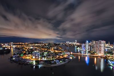 High angle view of illuminated buildings in city at night