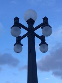 Low angle view of street light against sky