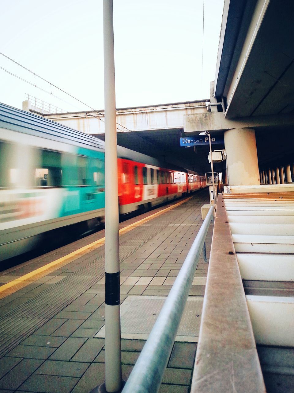 railroad track, railroad station platform, transportation, rail transportation, public transportation, railroad station, built structure, architecture, train - vehicle, building exterior, train, passenger train, railway track, public transport, clear sky, mode of transport, travel, railway station, station, city