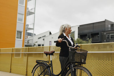 Senior woman with bicycle