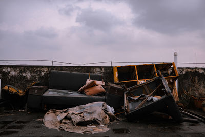 Abandoned car against sky