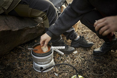 Low section of man preparing food