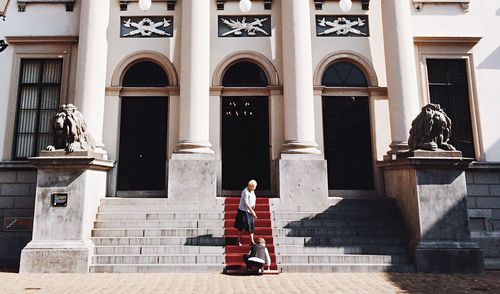 Woman in front of building