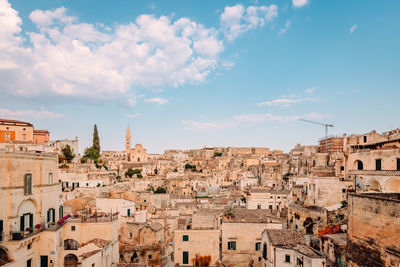 Sassi of matera from the luigi guerricchio belvedere, blue sky with clouds
