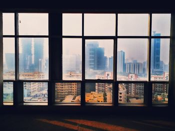 Buildings seen through glass window