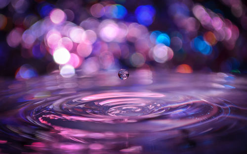 Close-up of water splashing against black background