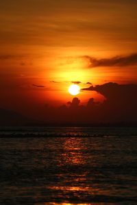 Scenic view of sea against romantic sky at sunset