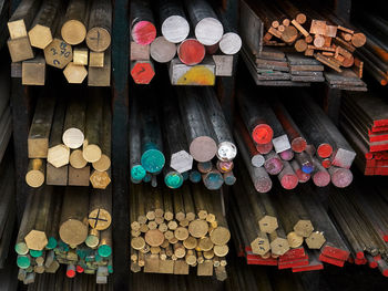 High angle view of colorful rods on shelves in store