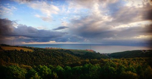 Scenic view of landscape against cloudy sky