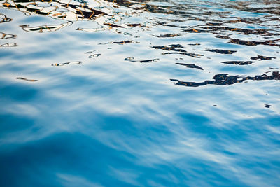 High angle view of rippled water against blue sky