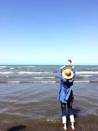 Woman standing on beach