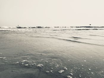 Scenic view of beach against clear sky
