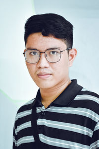 Portrait of young man wearing eyeglasses