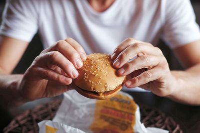Midsection of man holding ice cream