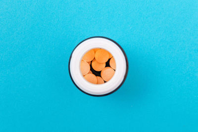 High angle view of tea cup on blue table
