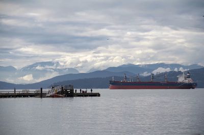 Scenic view of sea against cloudy sky