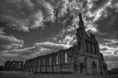 Built structure against cloudy sky