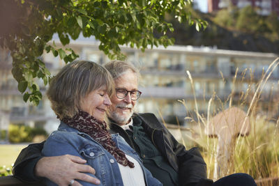 Mature couple relaxing on bench